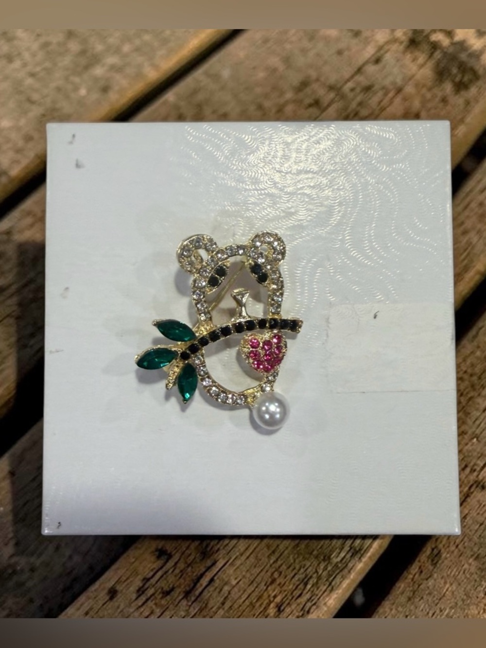 Gold-Tone Panda Brooch with Green Leaves and Pink Heart Accent
